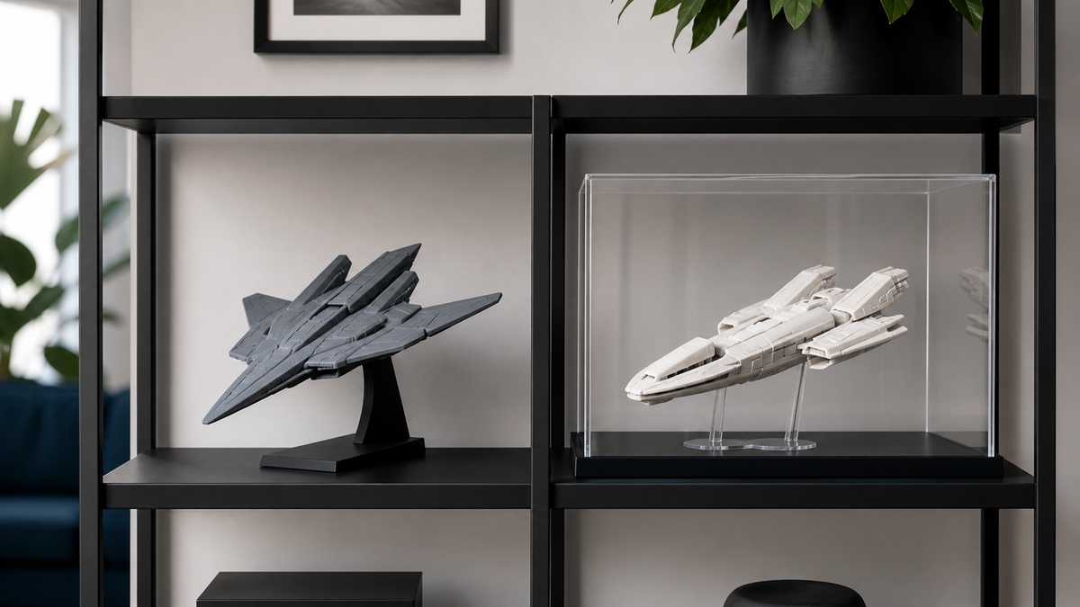 Generic 3D printed spacecraft models displayed on an open shelf and inside a clear protective case