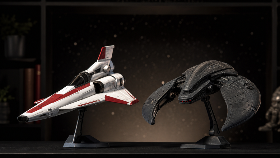 Two generic retro science-fiction fighter models with contrasting silhouettes displayed side by side
